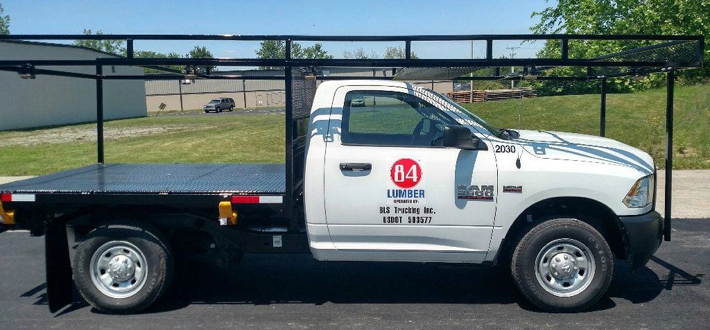 84 Lumber pickup truck with a flatbed rack