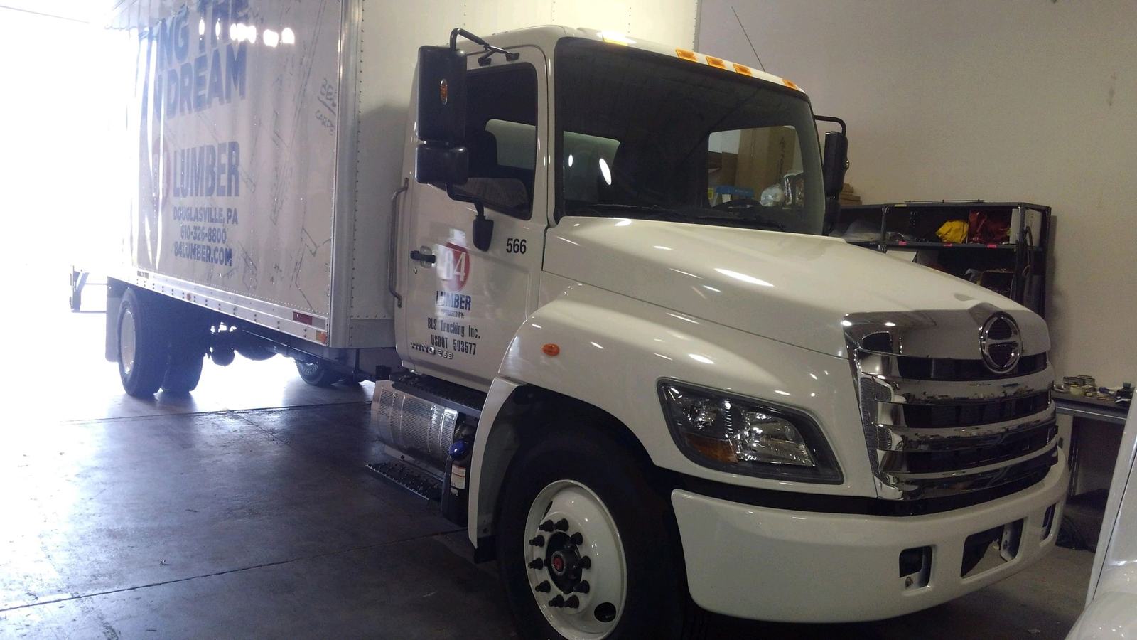 Hino box truck operated by BLS Trucking for 84 Lumber